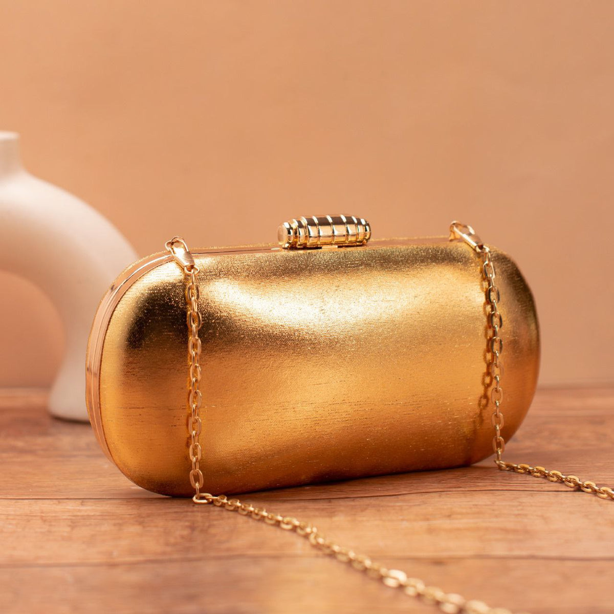 Golden Capsule Clutch